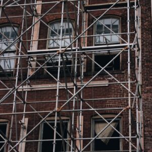 a brick building with windows with Centre Georges Pompidou in the background